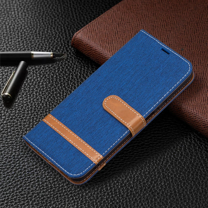 Blue denim-texture leather phone case with tan card holder and stitched flip cover