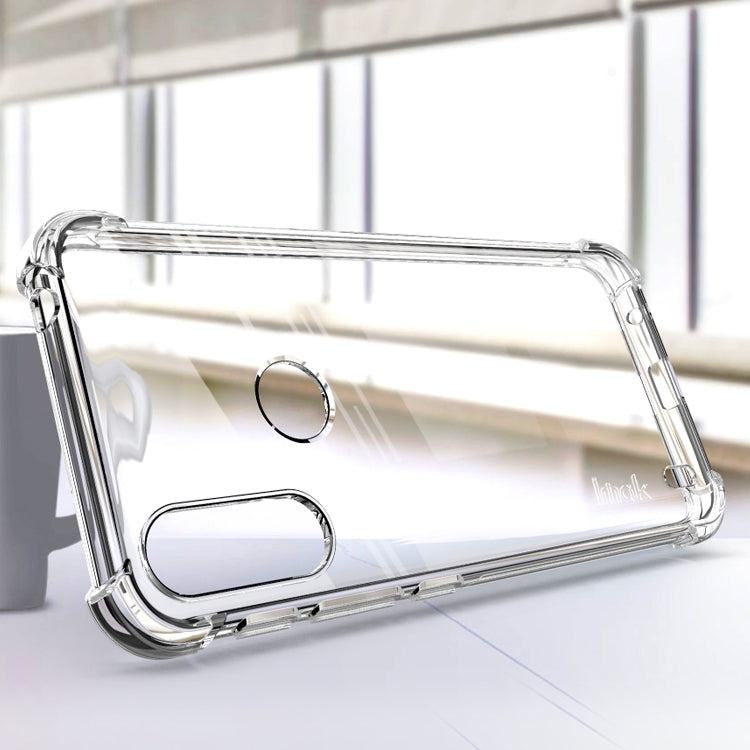 Transparent TPU phone case with circular cutout and protective shock corners