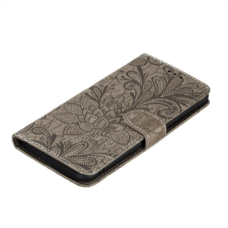 Embossed leather phone wallet case with floral lace pattern, flip cover closed