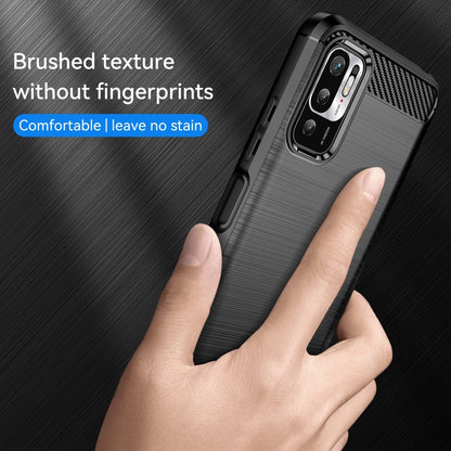 Black brushed TPU phone case with carbon-fiber camera frame, shown in hand