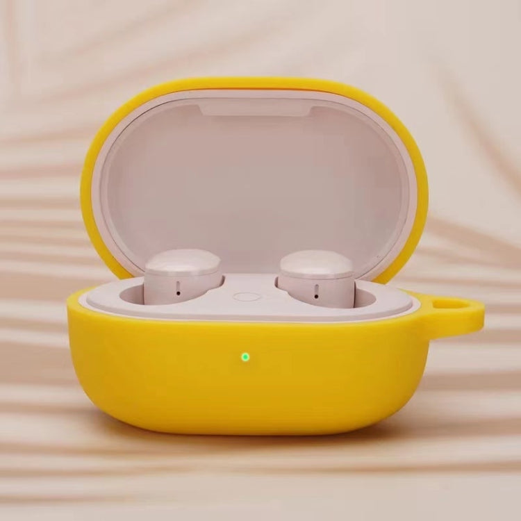 Yellow silicone earphone protective case with open lid and two white earbuds inside