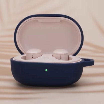 Navy blue silicone earphone protective case with open lid and two white earbuds inside
