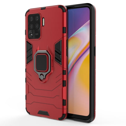 Red shockproof phone case with magnetic ring holder, textured grip, camera cutouts