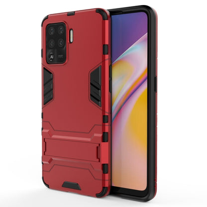 Rugged protective phone case in red with armor panels and camera cutouts
