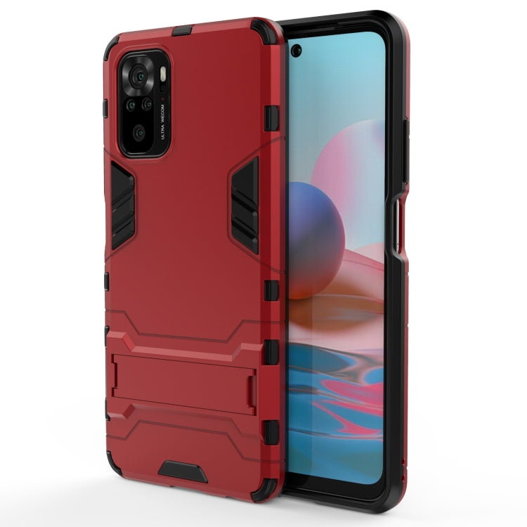 Rugged protective phone case in red with dark trim, armor pattern, and camera openings