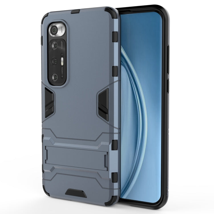 Rugged protective phone case in dark gray with armor panels and side grip cutouts