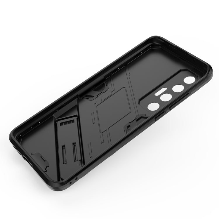 Black interior backplate for a phone case with camera cutouts and port openings.