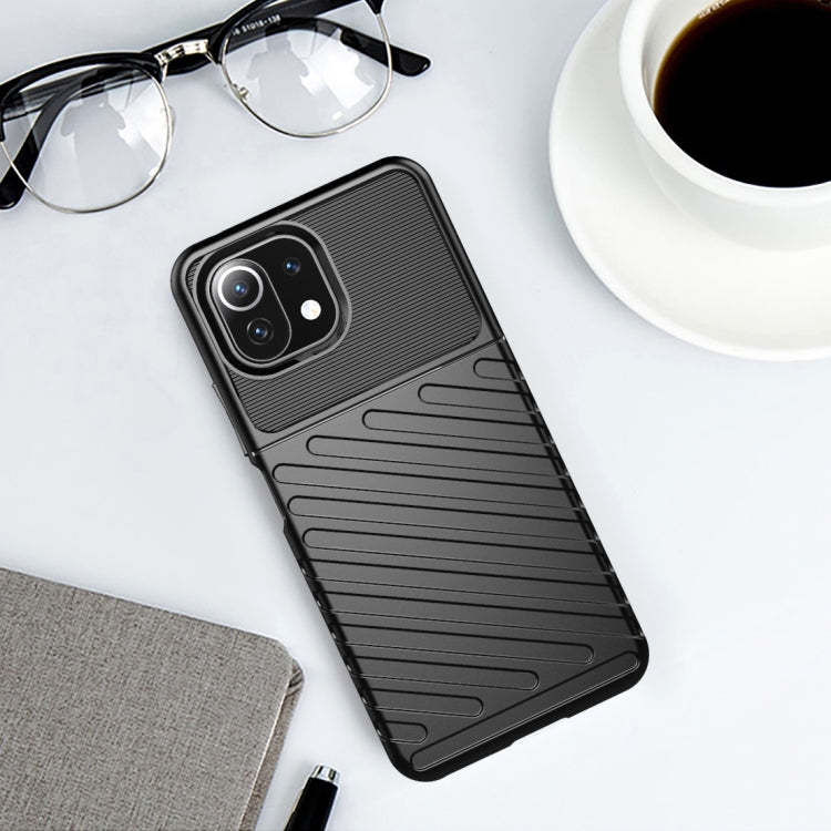 Black ribbed TPU phone case with cutouts and raised edges for camera