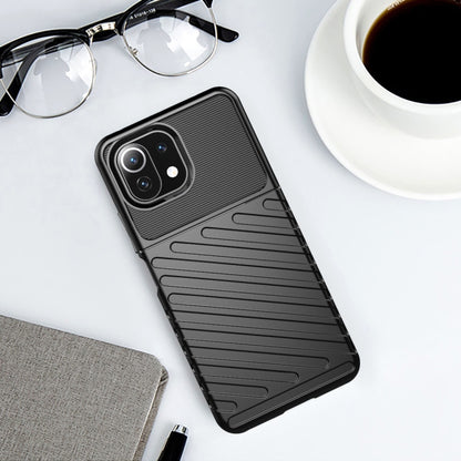 Black ribbed TPU phone case with cutouts and raised edges for camera