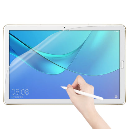 Matte paperfeel screen protector on tablet display, hand applying film
