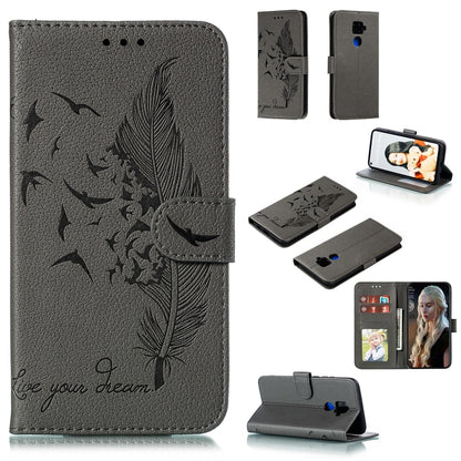 Gray textured leather flip phone case with feather pattern, card slots, and stand