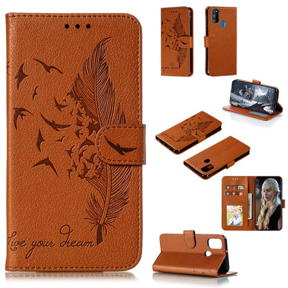 Orange flip leather phone case with feather bird pattern, card slots, and stand
