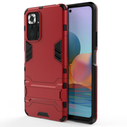 Rugged shockproof phone case in red with raised edges and camera cutouts