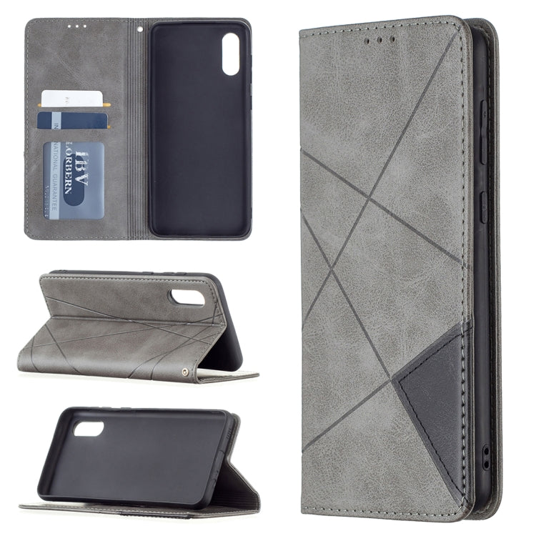 Grey leather-look flip phone case with rhombus pattern; side button cutouts and fold-out stand.