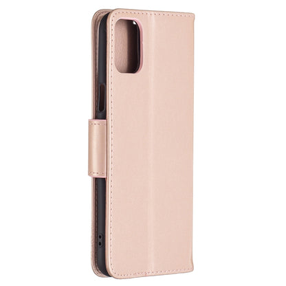 Rose gold leather phone wallet case with embossed butterflies, side view, and card holder
