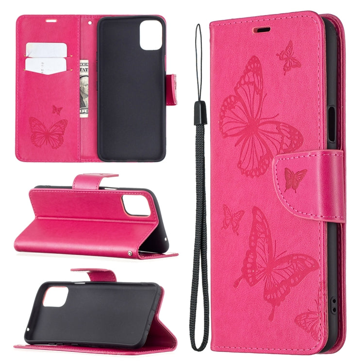 Pink leather phone wallet case with embossed butterflies, card slots, and lanyard