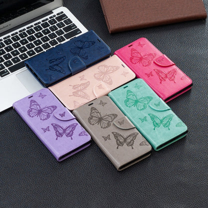 Assorted butterfly-embossed phone wallet cases with card slots and lanyard straps, mixed colors