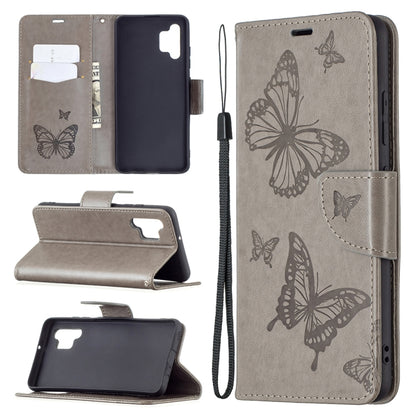Dark gray butterfly-embossed phone wallet case with card slots, stand, and lanyard strap