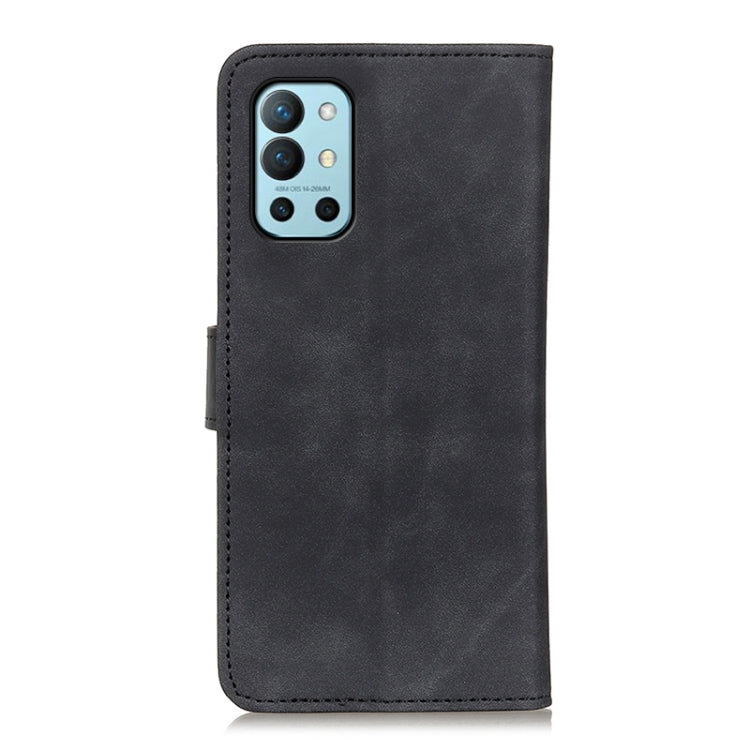 Black flip phone wallet case with camera cutout, front flap and KHAZNEH logo.