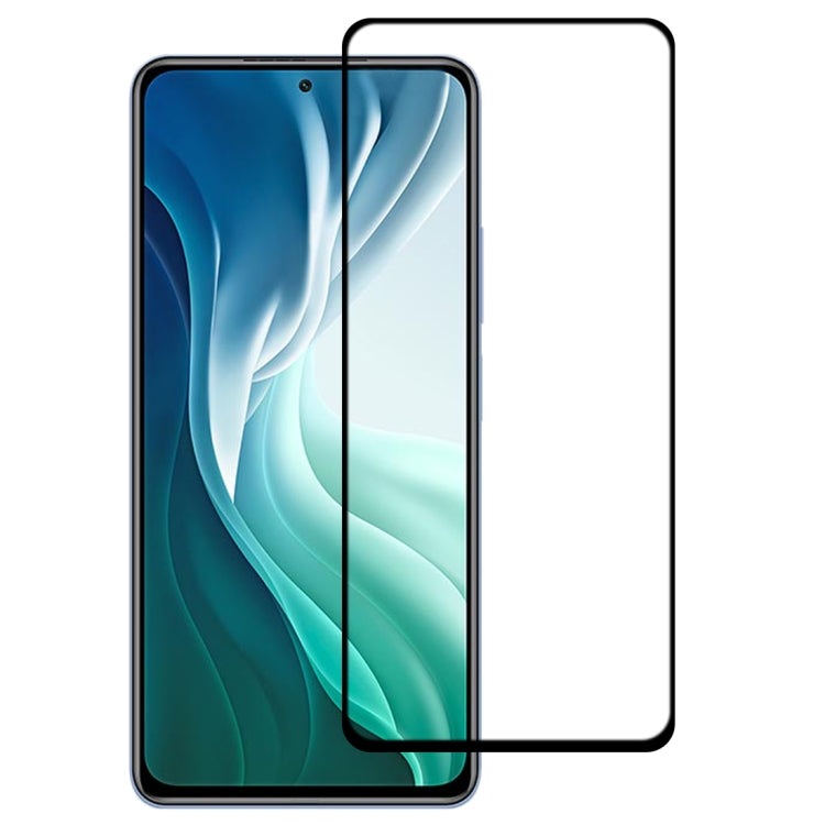 Curved tempered glass screen protector installed on a smartphone with blue wallpaper