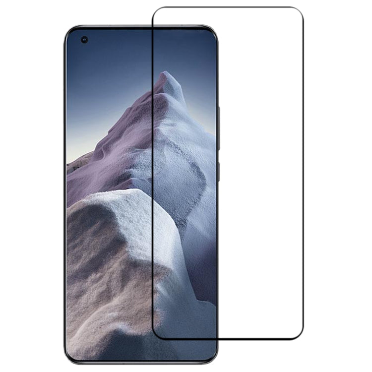 Curved tempered glass screen protector installed on a smartphone with mountain wallpaper