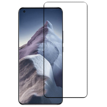 Curved tempered glass screen protector installed on a smartphone with mountain wallpaper