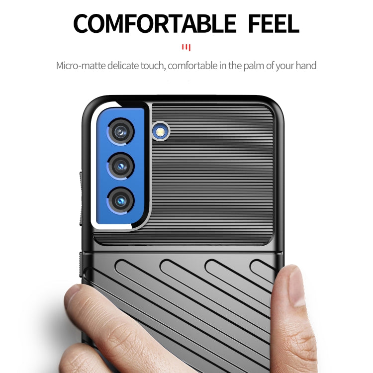 Black shockproof TPU phone case with ribbed texture, raised edge, and camera cutouts