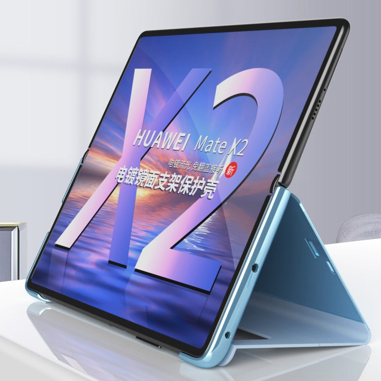 Blue mirror protective phone case with fold stand holding the phone upright