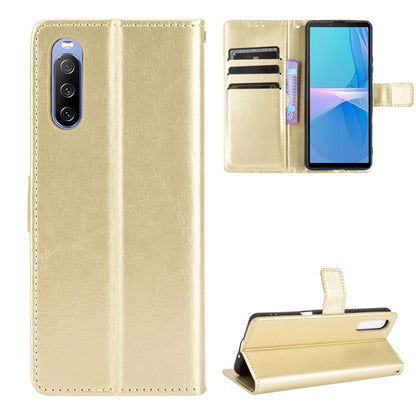 Gold flip phone wallet case with card slots and photo holder, leather-look texture.