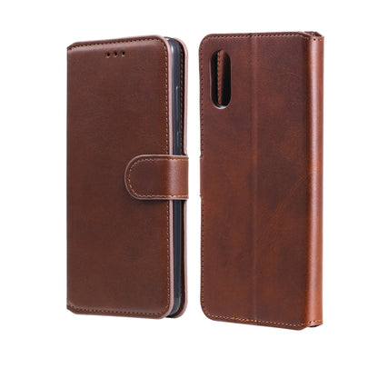 Brown flip phone wallet case with magnetic strap and camera cutout.