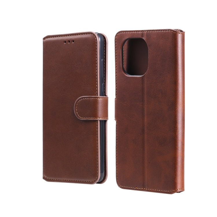 Brown flip leather-look phone case with side strap and camera cutout pocket.