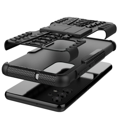 Black rugged phone case with tire tread texture and integrated holder kickstand