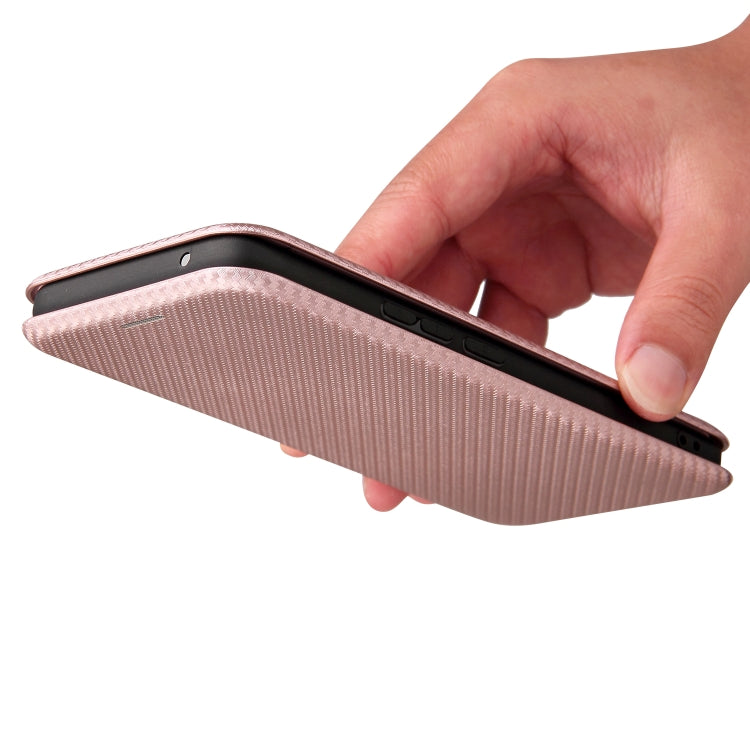 Pink carbon fiber texture magnetic flip phone case being flipped open by a hand