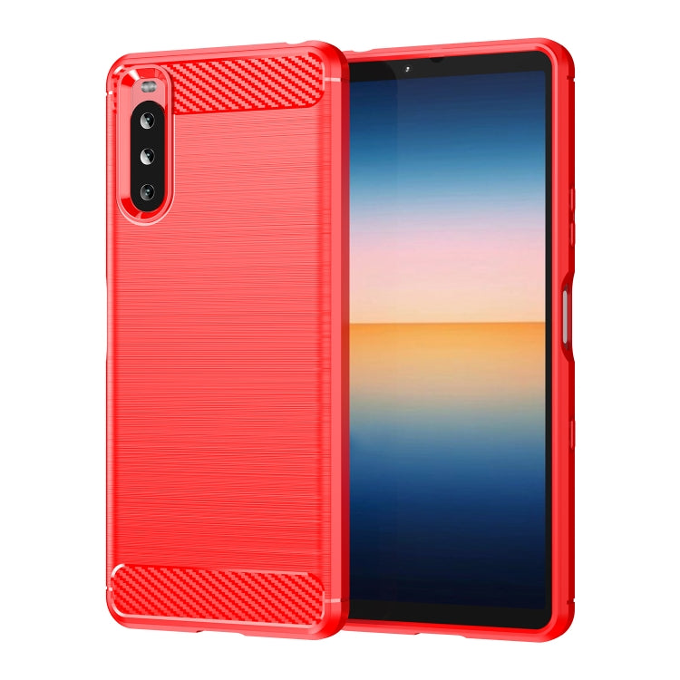 Red brushed TPU phone case with carbon-fiber panel accents and raised camera cutout