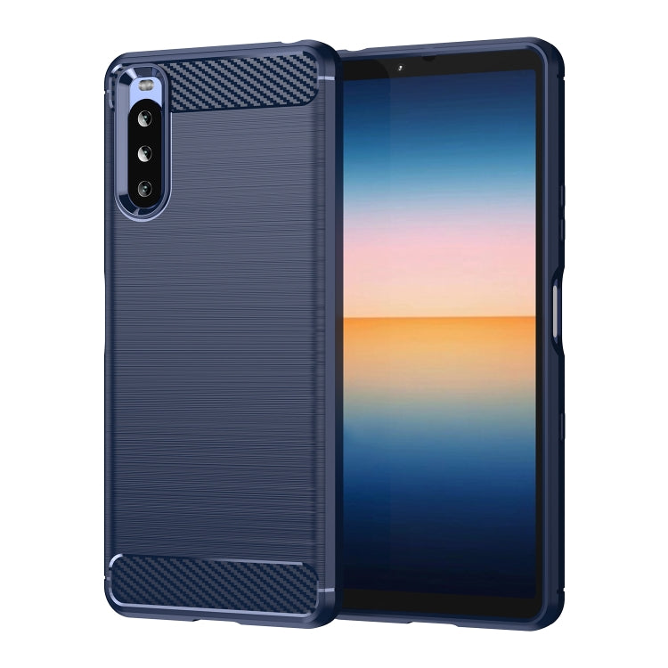 Navy blue carbon fiber TPU phone case with brushed texture, camera cutout.