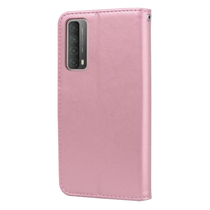 Pink PU leather flip phone case with floral embossing and camera cutout