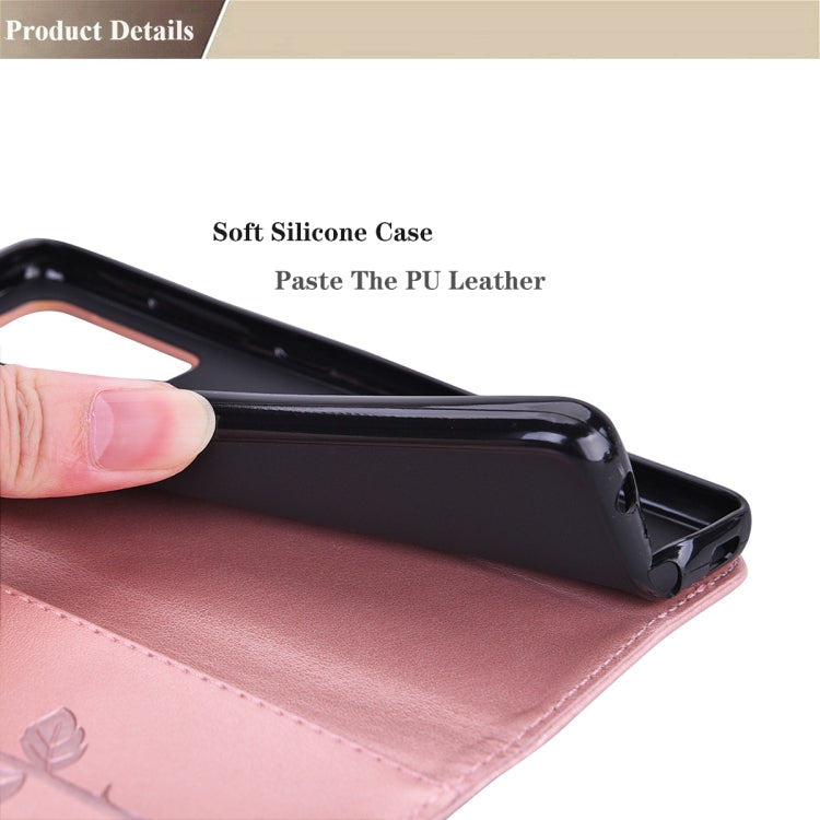 Pink PU leather flip phone case with rose embossing and protective fold-over cover