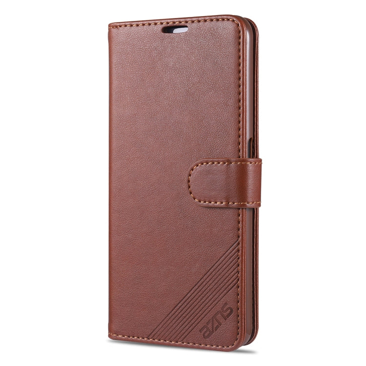 Brown leather flip wallet case with side strap closure and card holder cutout