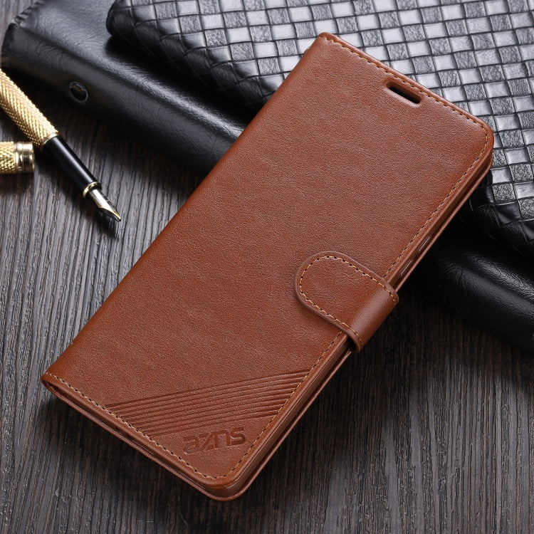 Brown leather flip phone case with holder strap and textured stitched front