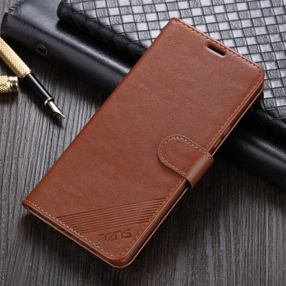 Brown leather flip phone case with holder strap and textured stitched front