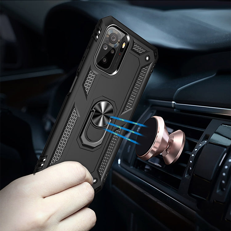Black rugged phone case with metal ring stand mounted in car vent holder