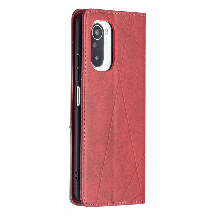 Red leather flip phone case with rhombus texture, camera cutout, and stitched edges