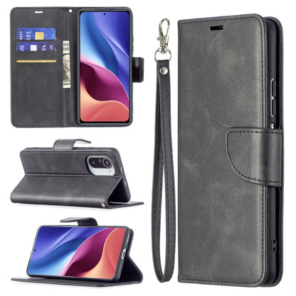 Dark gray PU flip phone case with wallet card slots and wrist lanyard