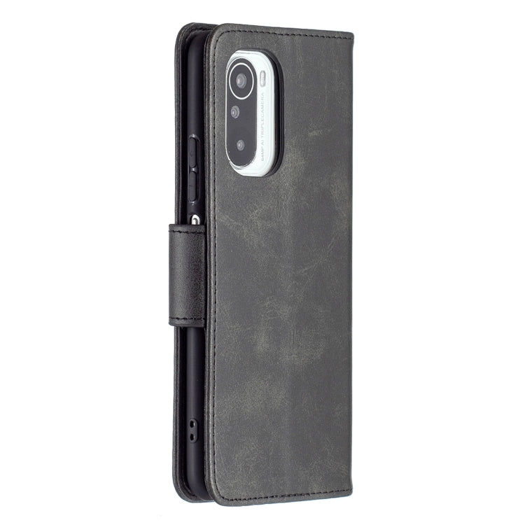 Dark gray PU flip phone case with camera cutout and side buttons