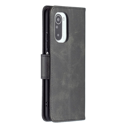 Dark gray PU flip phone case with camera cutout and side buttons