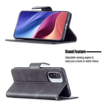 Dark gray PU flip phone case with built-in viewing stand feature