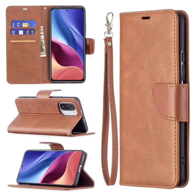 Brown lambskin-style leather phone wallet case with flip cover, card slots, and wrist strap