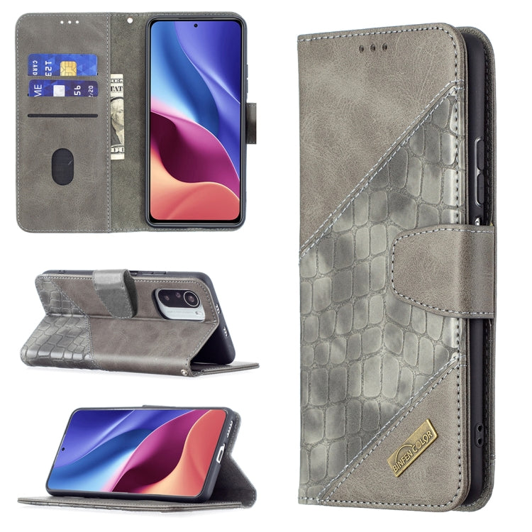 Gray crocodile-texture flip phone case with wallet, card slots, and stand