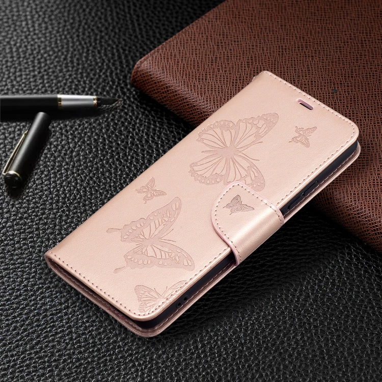 Rose gold leather wallet-style phone case with embossed butterflies