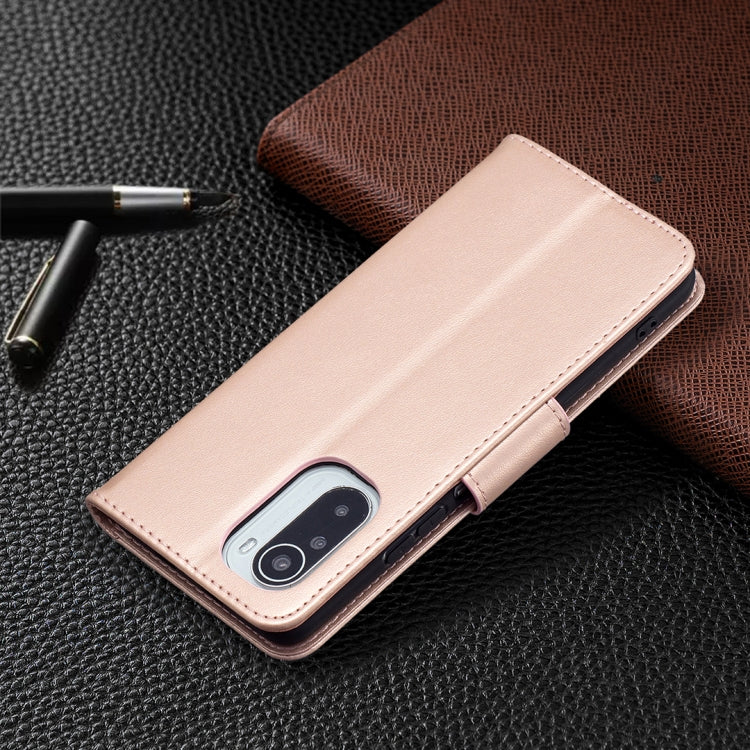 Rose gold leather phone case with embossed butterflies and bottom camera opening